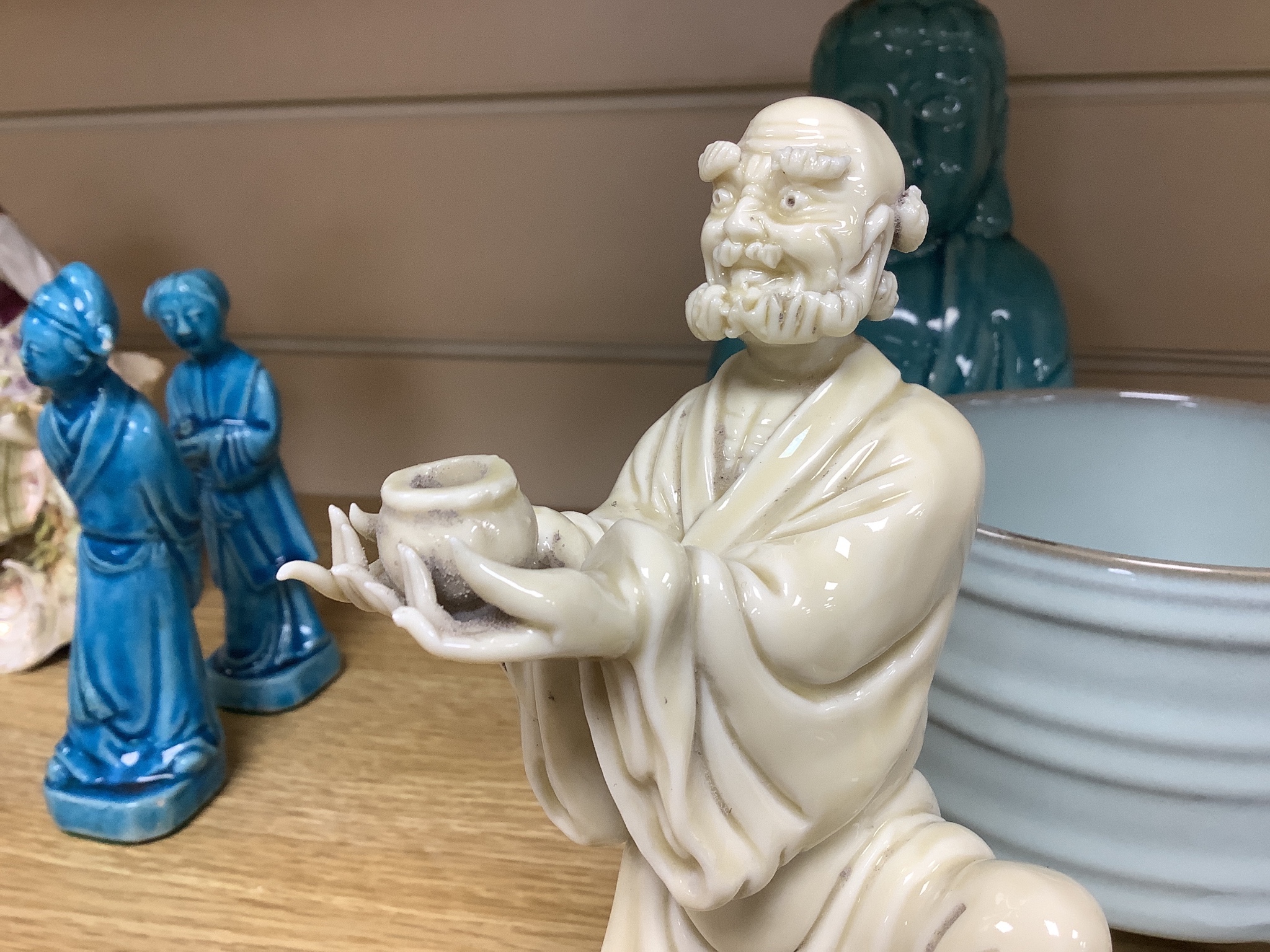A Chinese turquoise glazed Buddha, height 21cm, a pair of figurines, a robin’s egg glazed model of a lobster, and a tripod censer